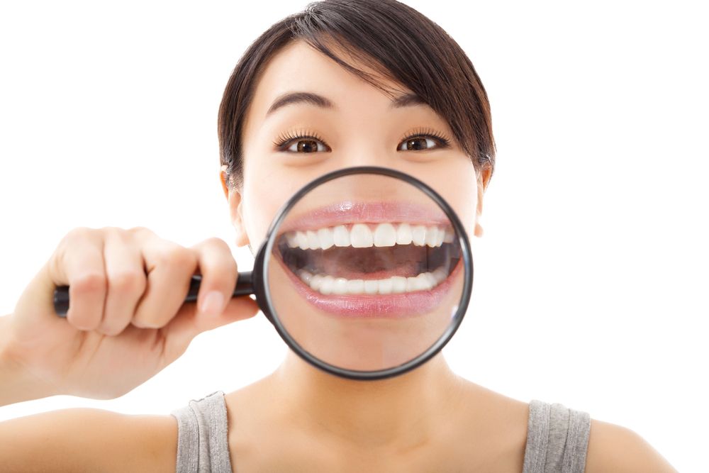 woman magnifying her teeth