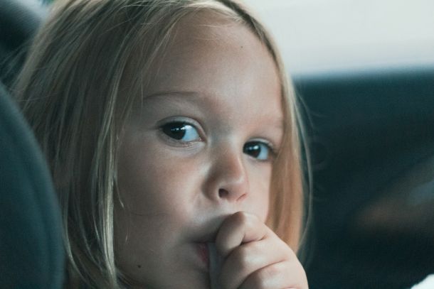 close up of child thumb sucking