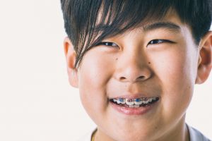 young boy with braces