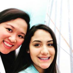 Dr. Tun and patient with braces smiling